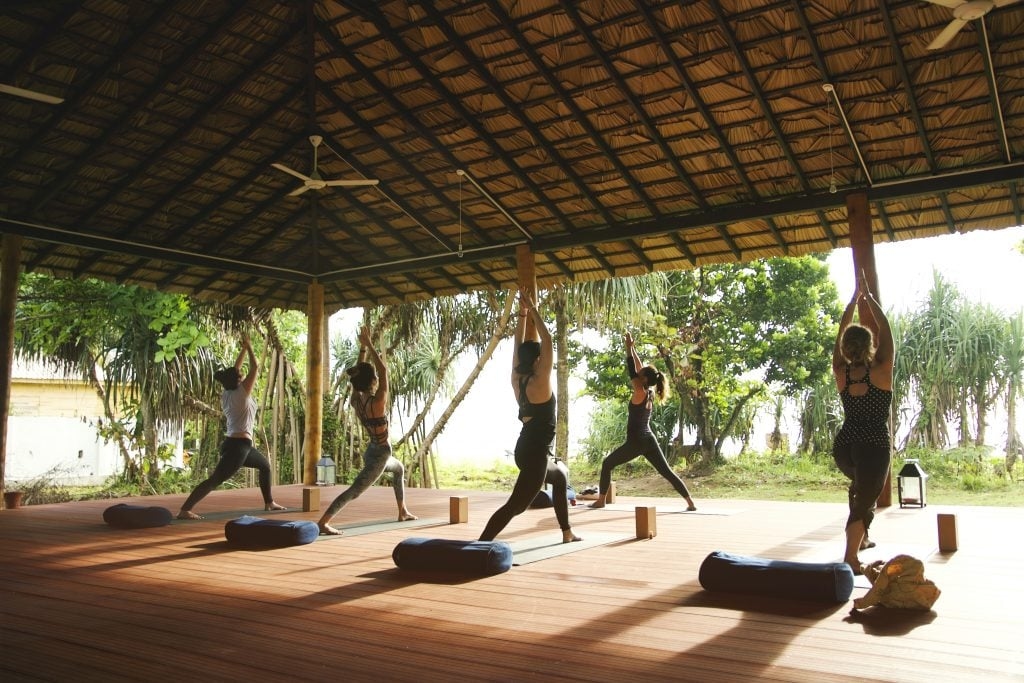 Sunrise yoga and wellness activities at the beach